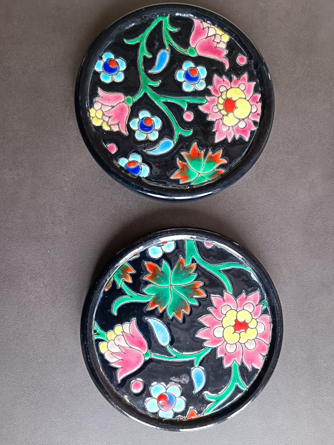 Pair of Longwy flower bottle underwear on black background. Rare