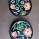 Pair of Longwy flower bottle underwear on black background. Rare