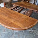 Extendable walnut table in the Napoleon III style.