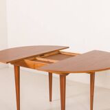 Scandinavian round teak table with hidden extension, 1970s