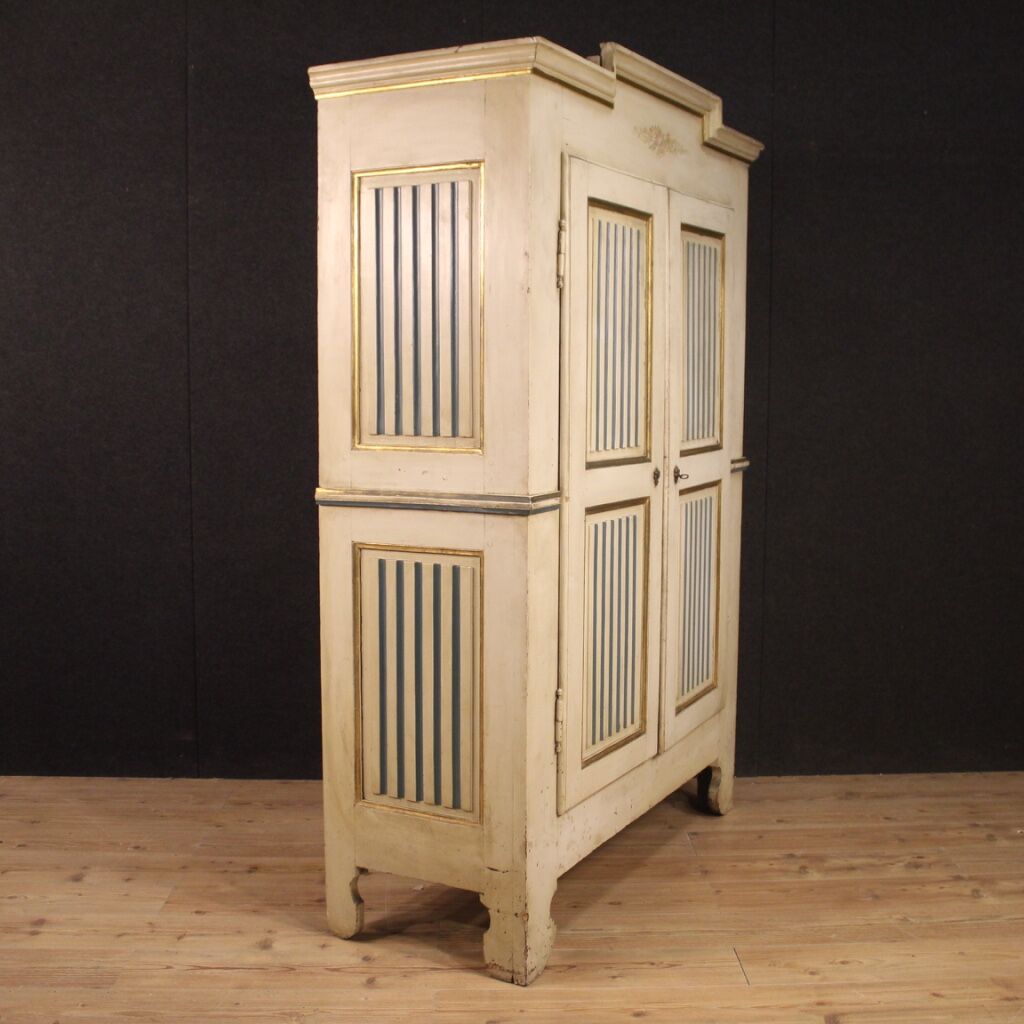 Antique lacquered and gilded Italian wardrobe in Louis XVI style from 19th century