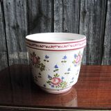 Vintage ceramic pot with hand-painted floral decoration.