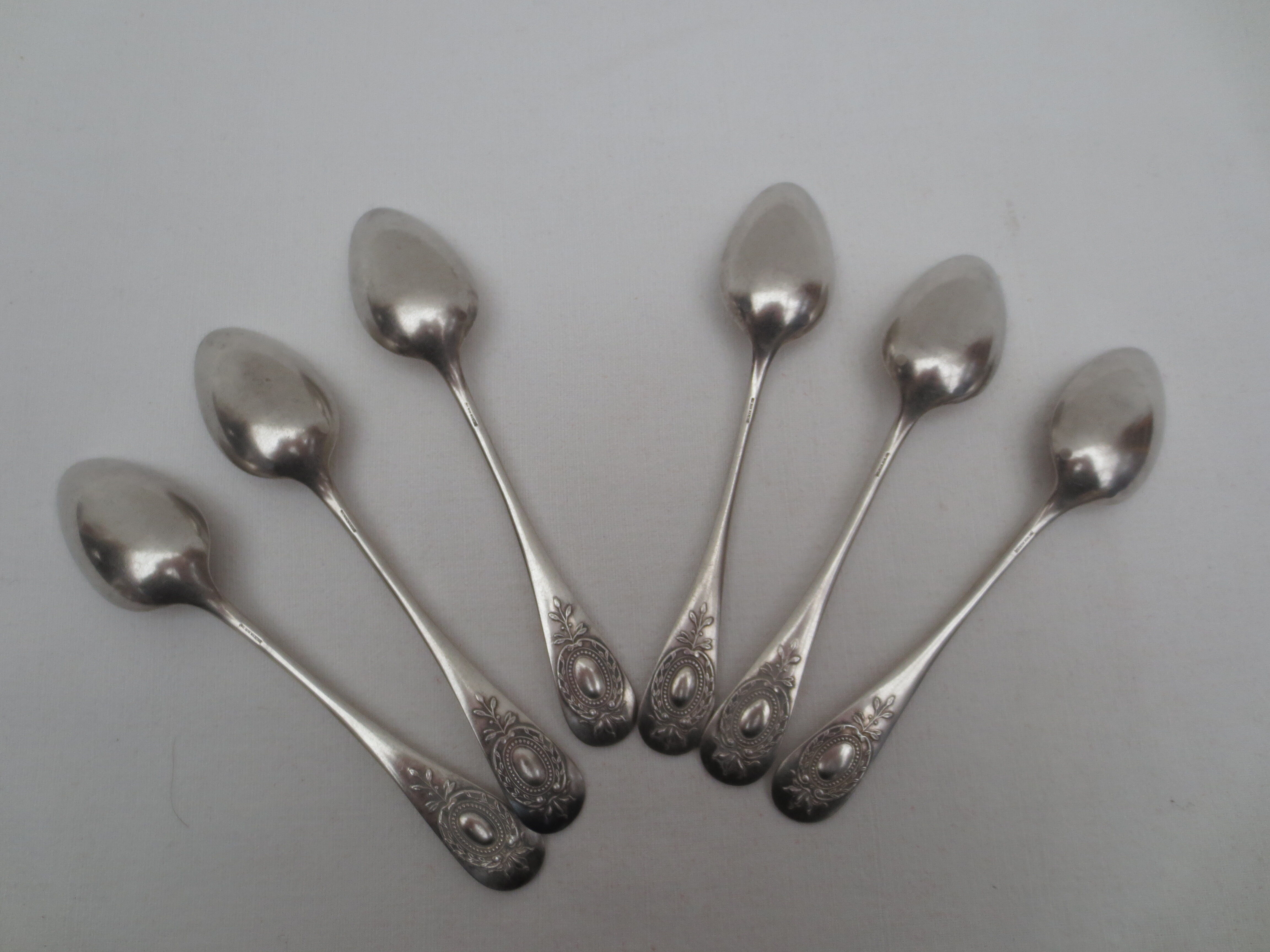 Suite of 6 small silver dessert spoons, medallion decoration