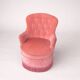 Vintage pink velvet buttoned armchair with fringes.