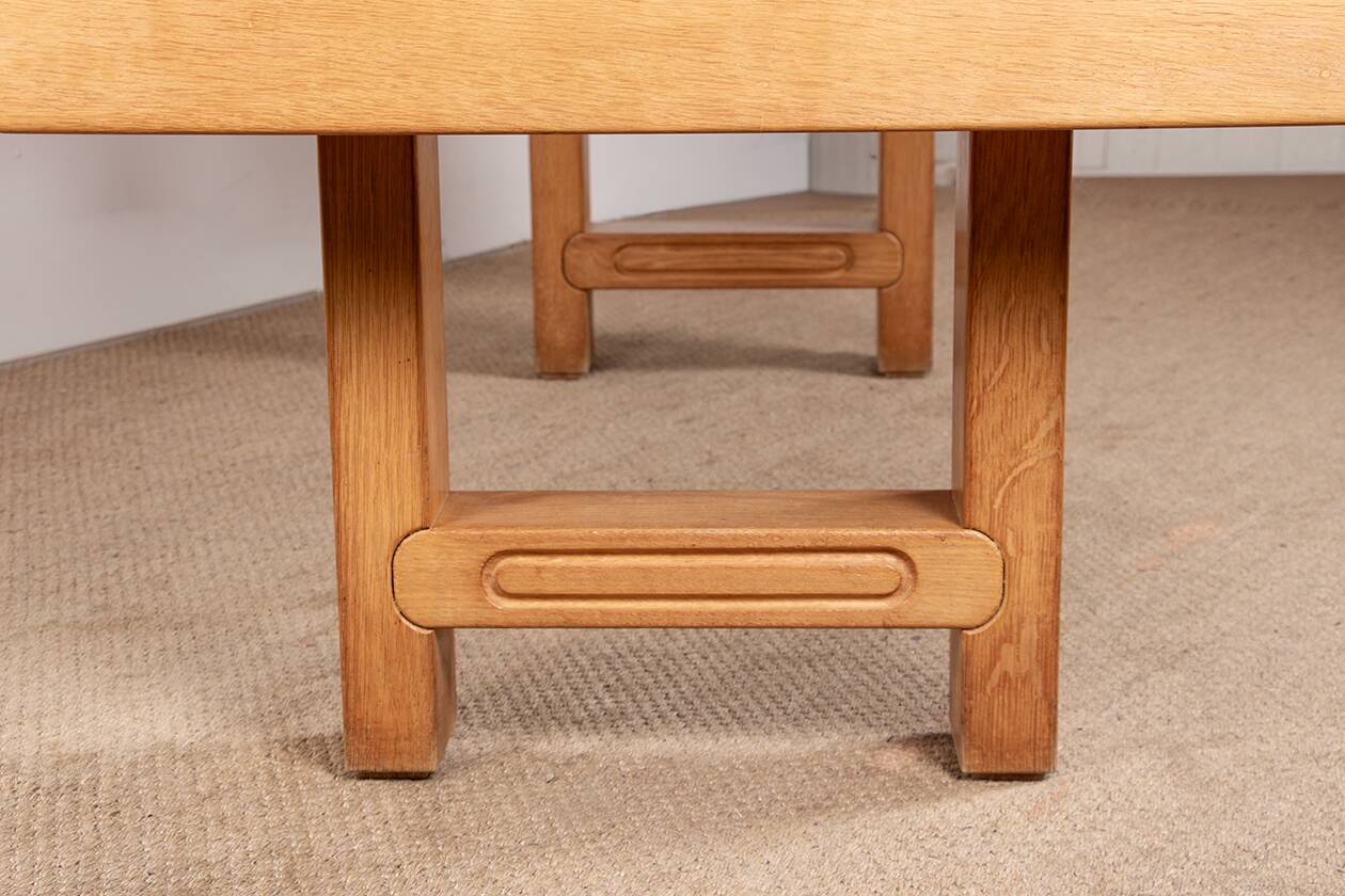 Large extendable dining table in solid oak by Guillerme and Chambron.