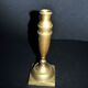 Antique baluster candlestick in bronze with hand-chiseled design.