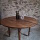 French antique round dining table in walnut, circa 1880–1900.