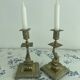 Pair of brass dolphin candlesticks, late 19th century, Napoleonic period