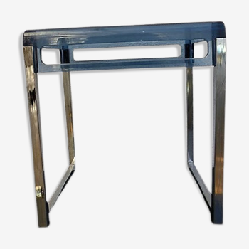 Vintage coffee table design in Plexiglas and chrome metal.