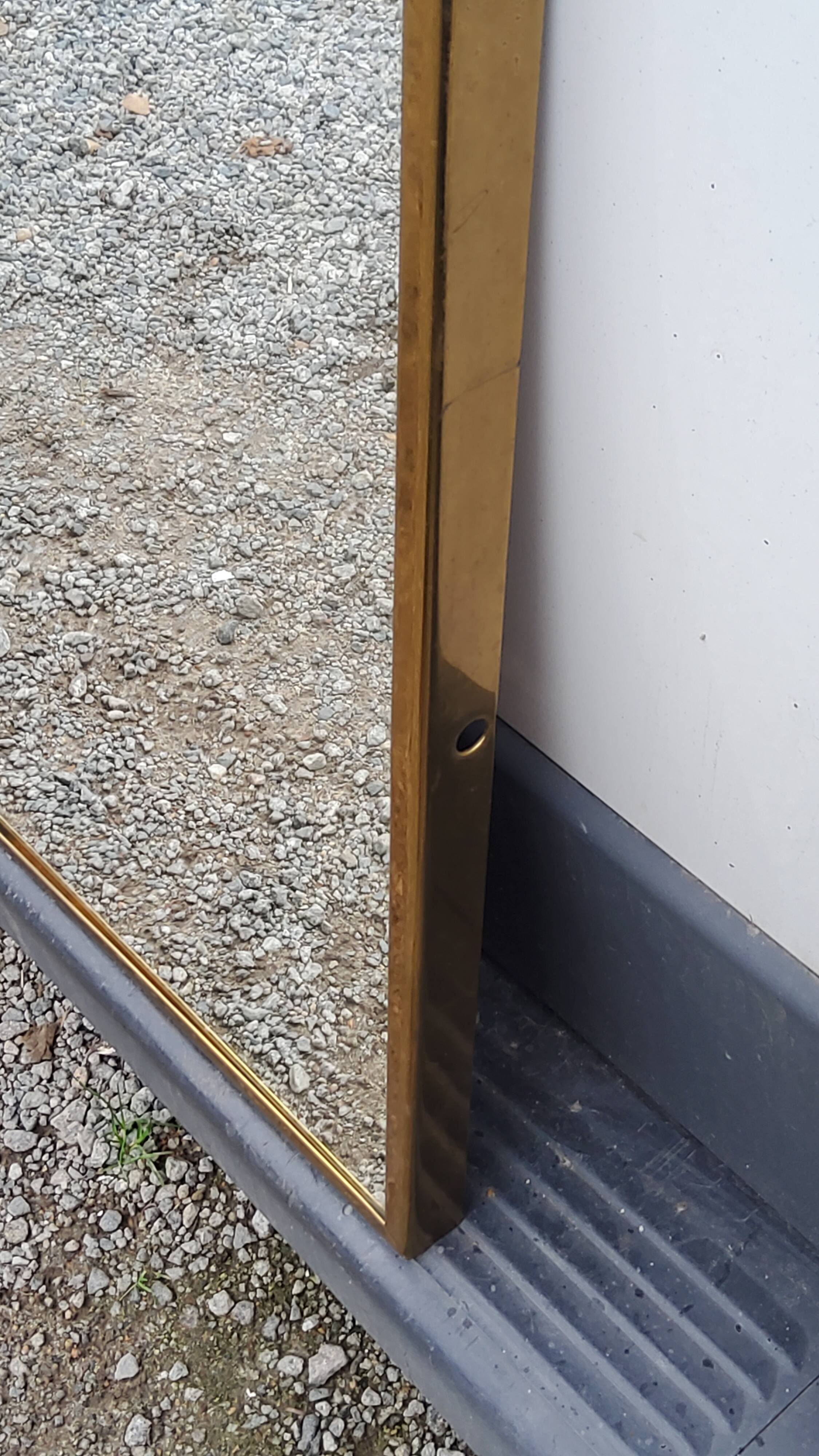 Mirror of the 70s in gilded metal, 60x35 cm