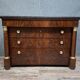 Empire commode in mahogany and flame mahogany veneer, 19th century.