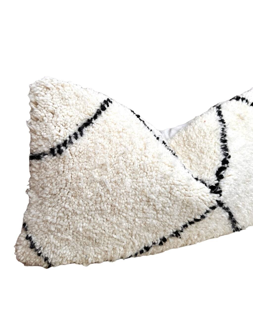 Bohemian wool pillow cover on a Beni Ourain Berber cushion. The cushion cover