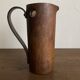 Mountain pitcher in monoxile wood and leather folk art