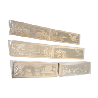 Series of 6 silver metal knife holders