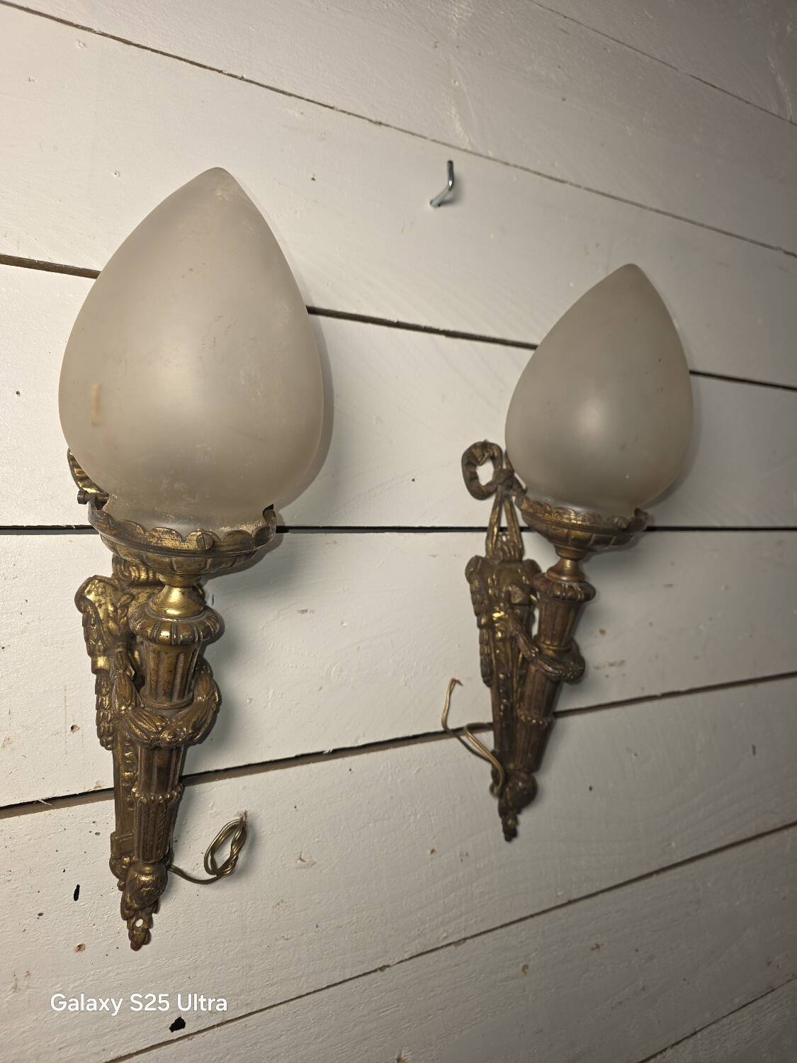 Pair of torch wall lights in Louis XVI style in 19th-century bronze.