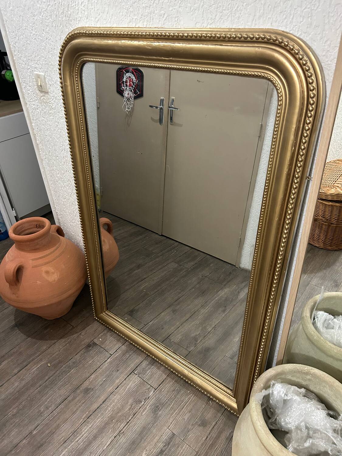 Antique gilded mirror in old Louis Philippe wood