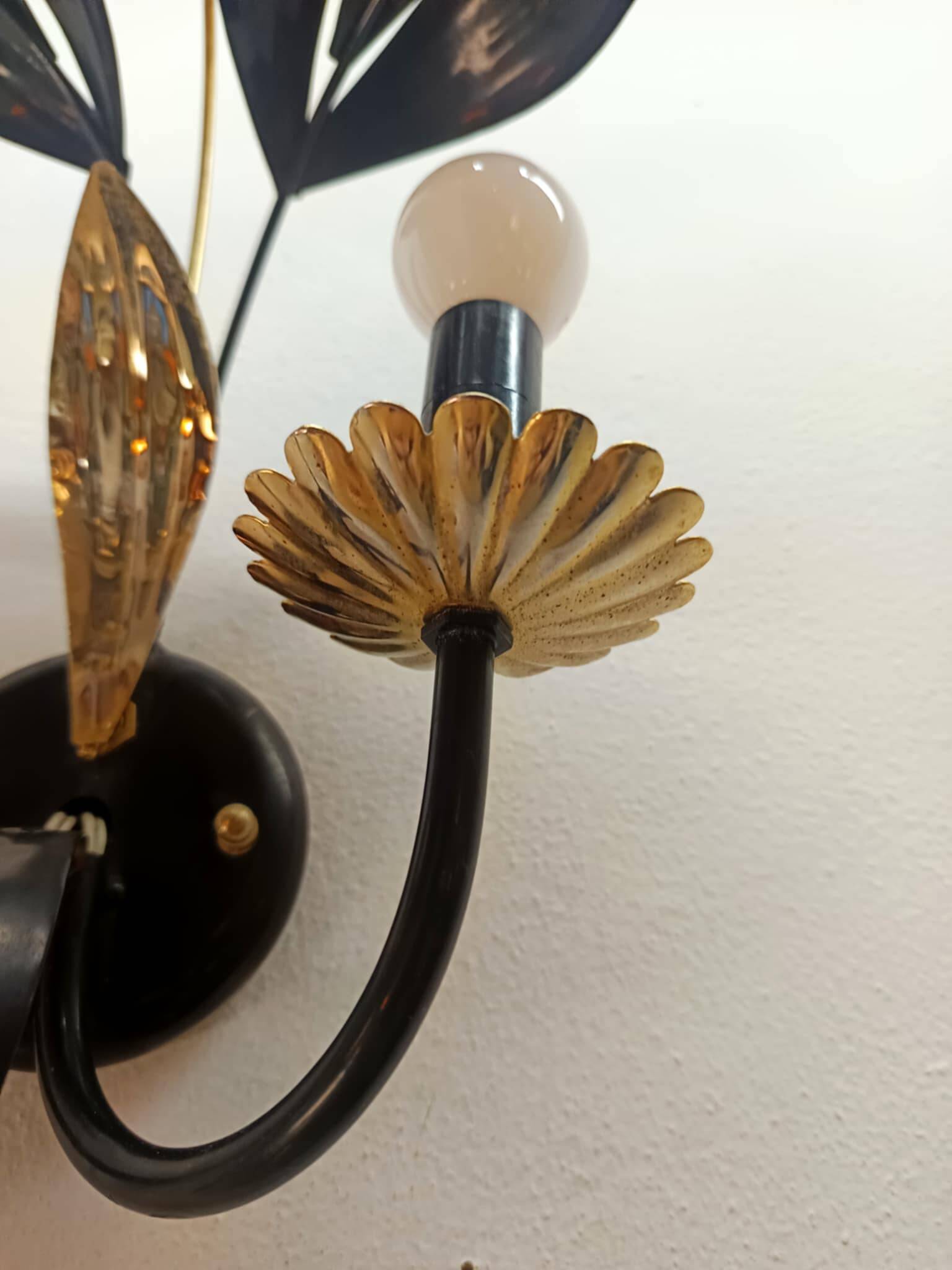 Black and gold Hollywood Regency leaf wall sconce