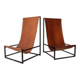 Pair of vintage armchairs in stretched leather and metal structure
