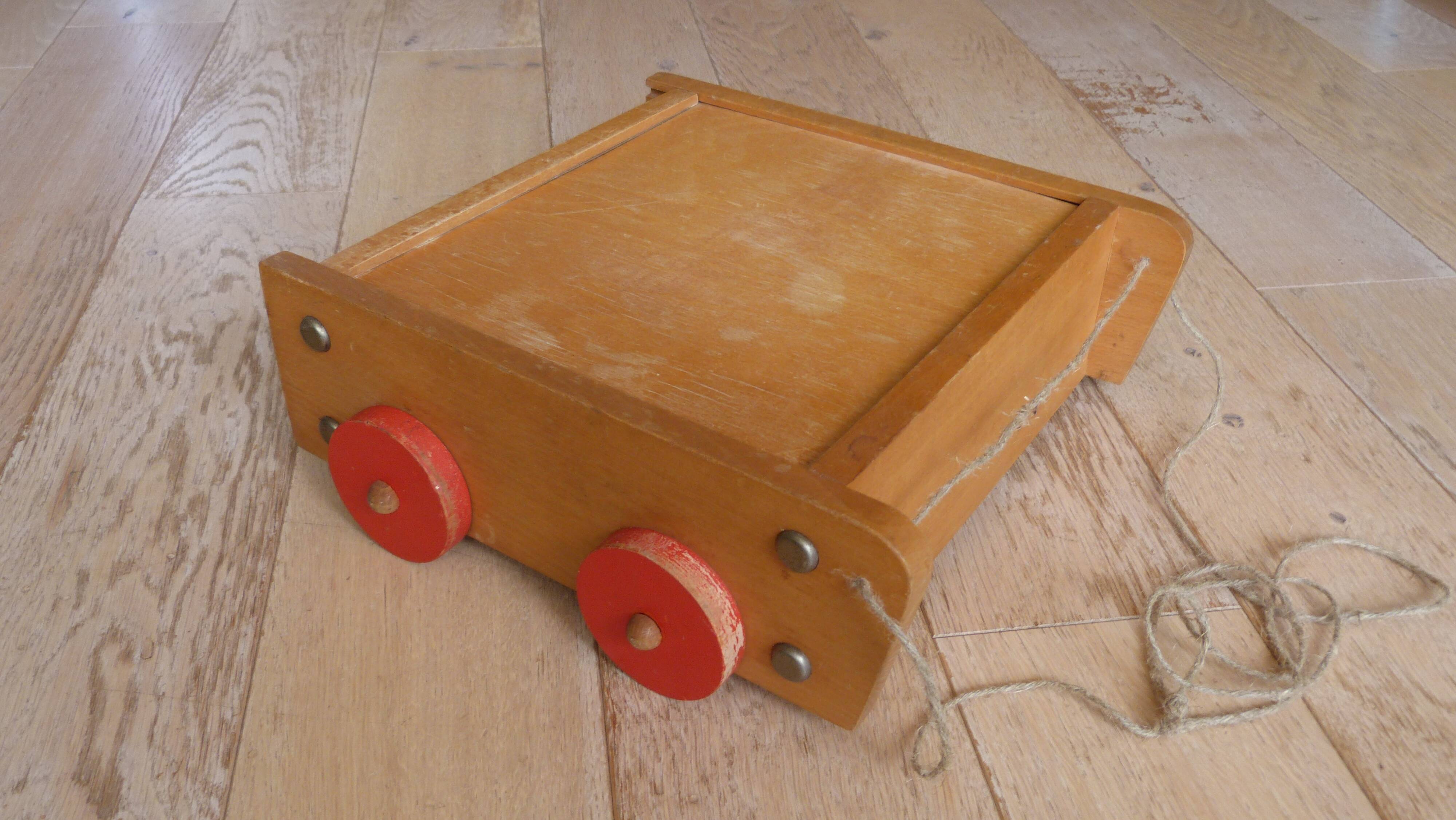 Old raw wood construction game in its cart
