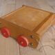 Old raw wood construction game in its cart