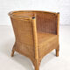 Pair of cabriolet armchairs in wicker and black edging