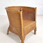 Pair of cabriolet armchairs in wicker and black edging