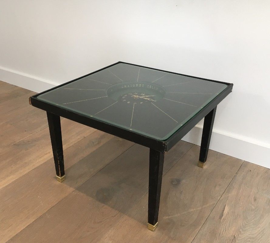 Rare small clock table in leather and brass. In the style of Jacques Adnet.