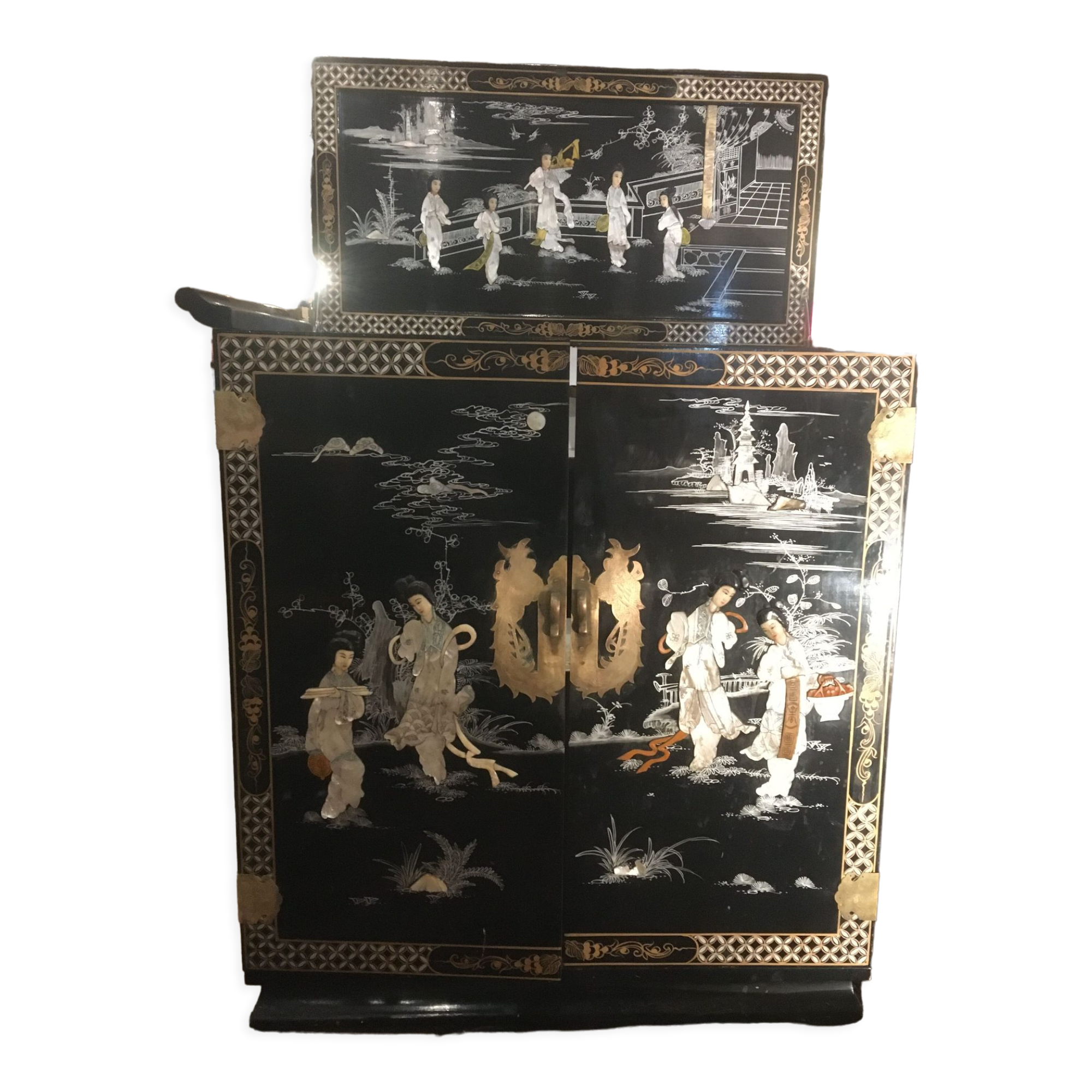 Asian lacquer cabinet with mother-of-pearl relief pattern