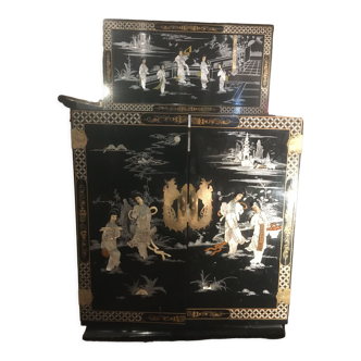 Asian lacquer cabinet with mother-of-pearl relief pattern