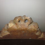 Old wooden pediment stucco