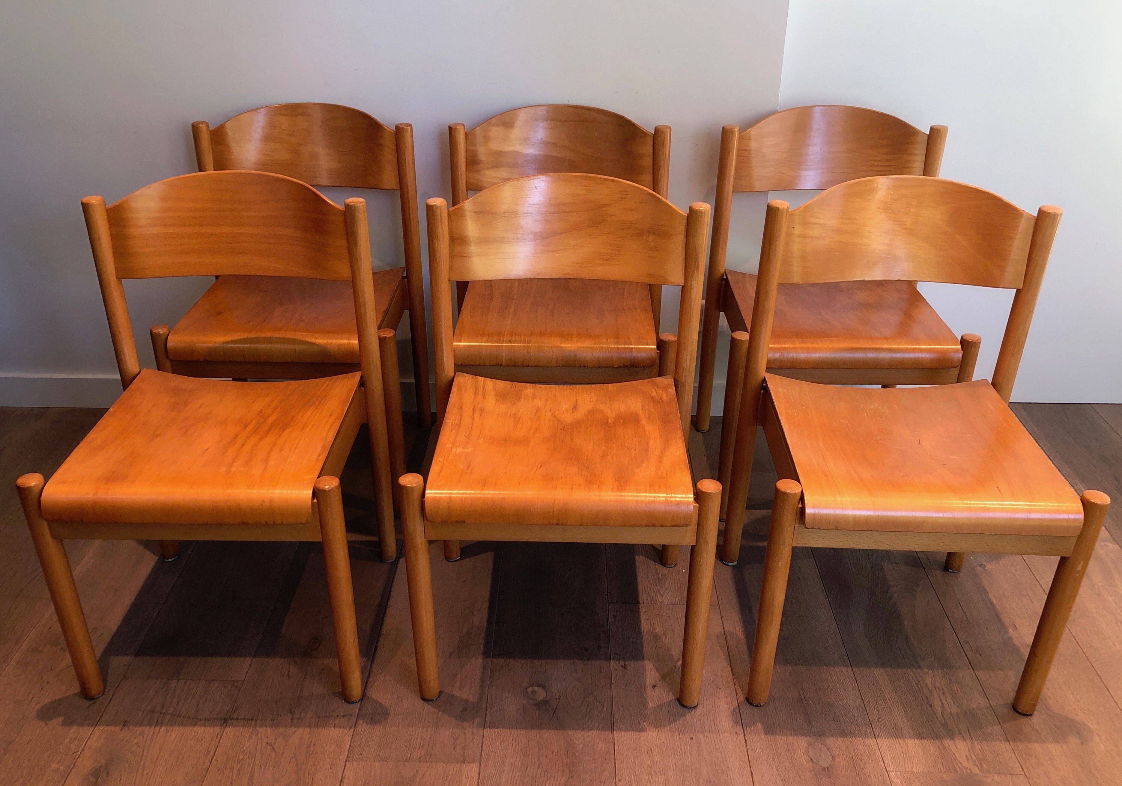 Set of 6 stackable chairs in fir wood.