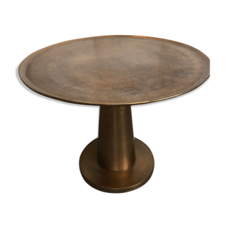 Gold-colored large round metal table