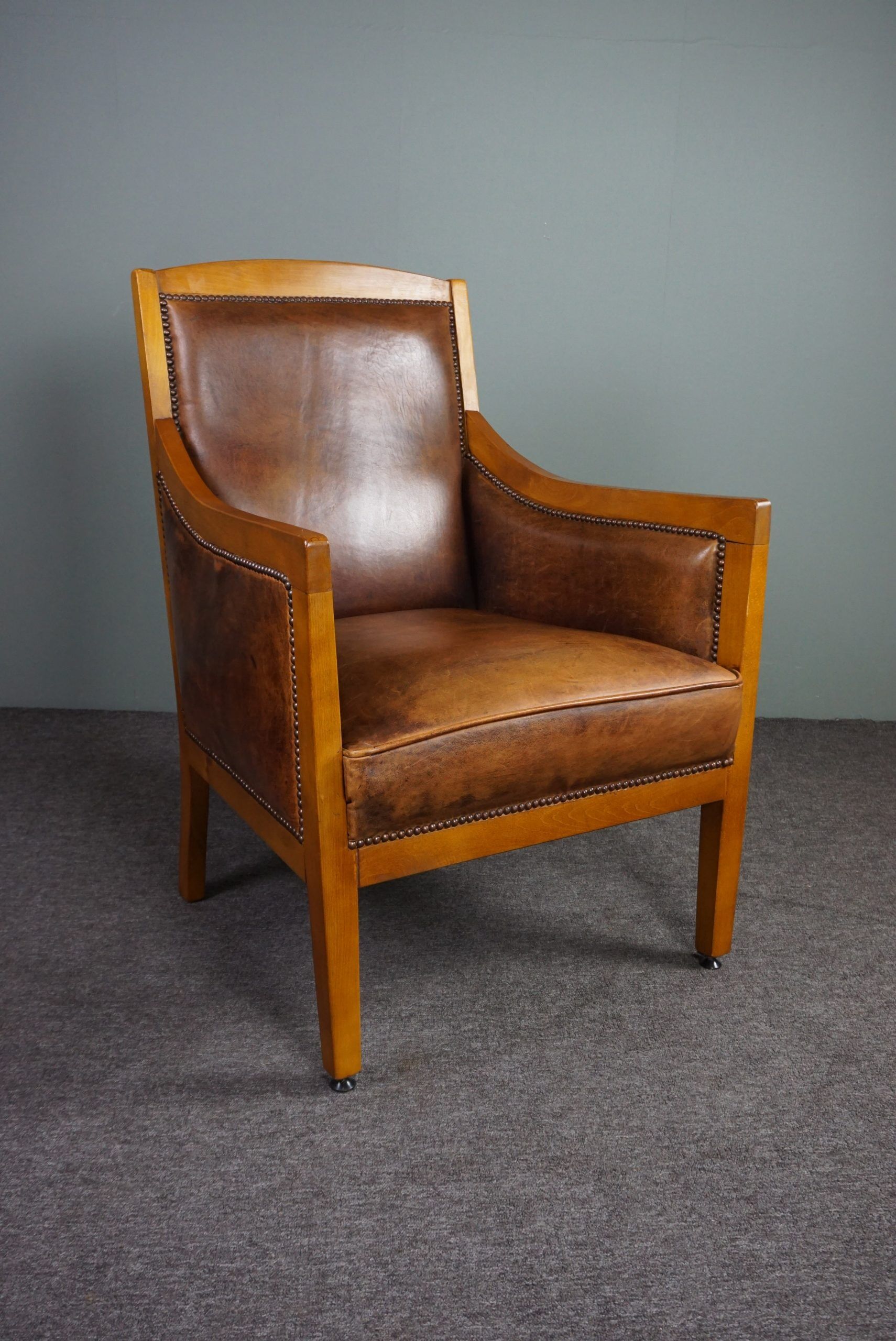 Armchair in sheepskin with beautiful light wood