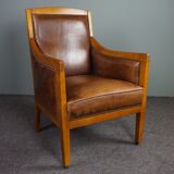 Armchair in sheepskin with beautiful light wood