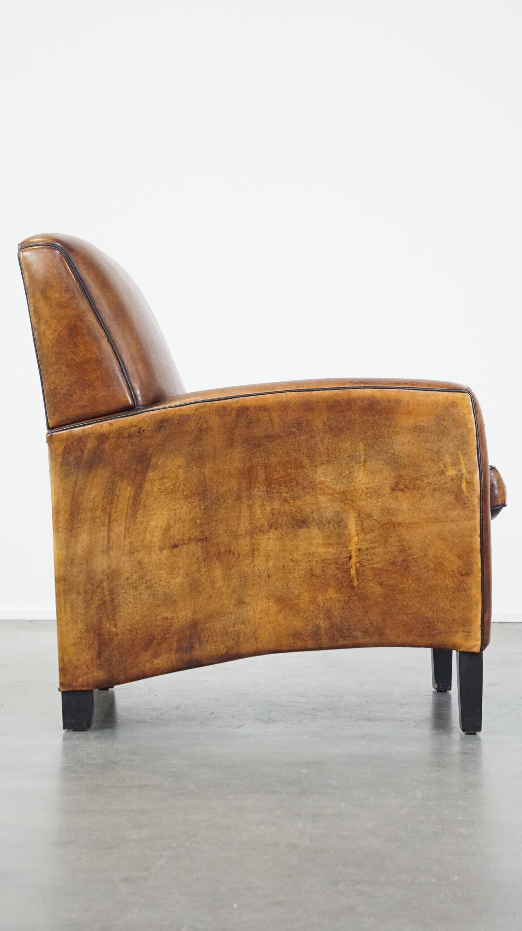Art Deco sheep leather armchair with a lot of character