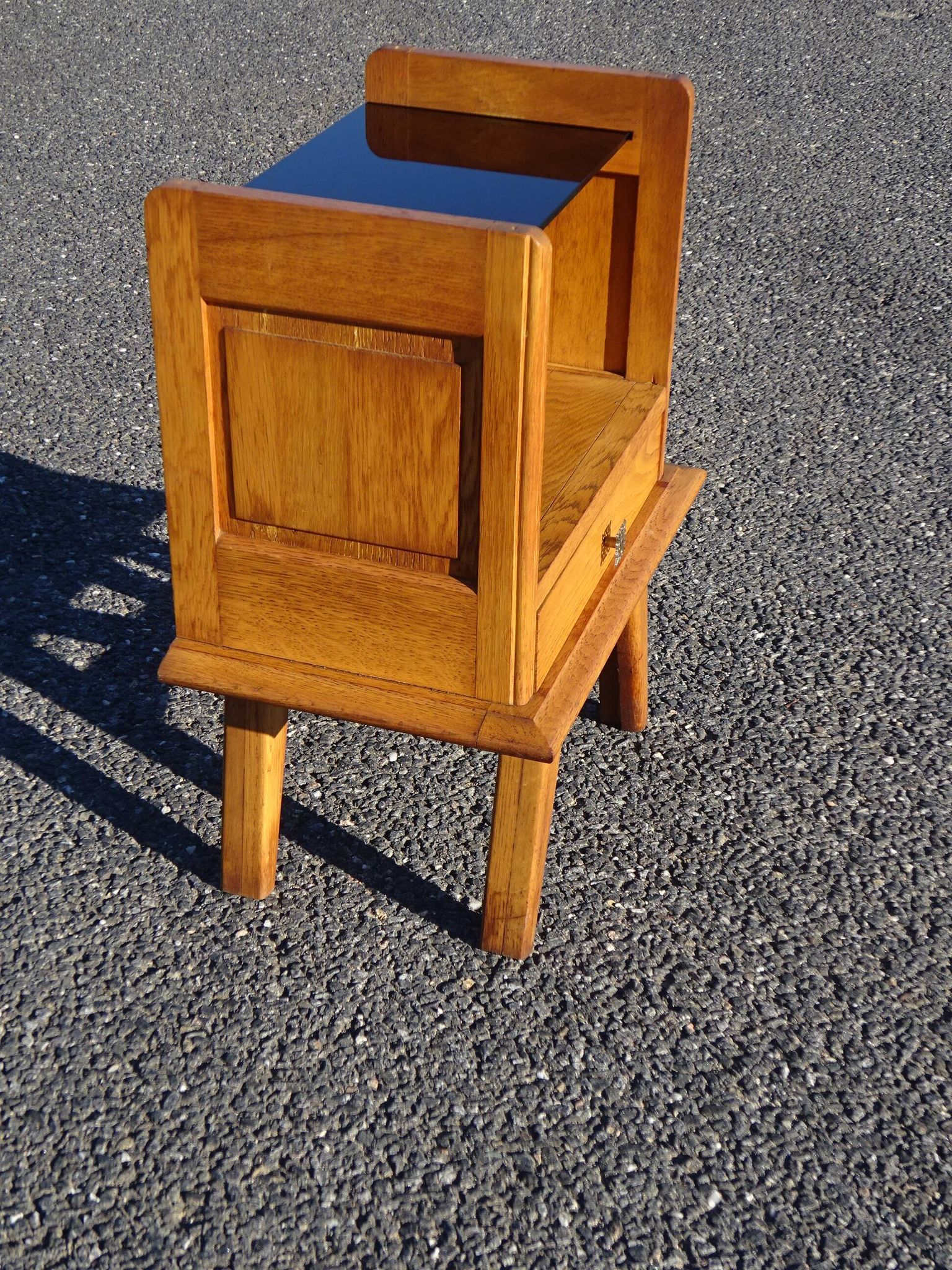 Vintage oak bedside table with tapered legs.