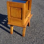 Vintage oak bedside table with tapered legs.