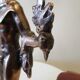 Large kerosene lamp mounted on bronze statue. Late nineteenth century