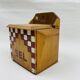 Old wooden salt box with red and white checkerboard decoration