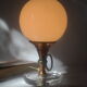 Vintage globe lamp in glass, copper, and brass.
