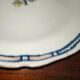 Old earthenware plate of the North XVIIIth Century with floral decoration