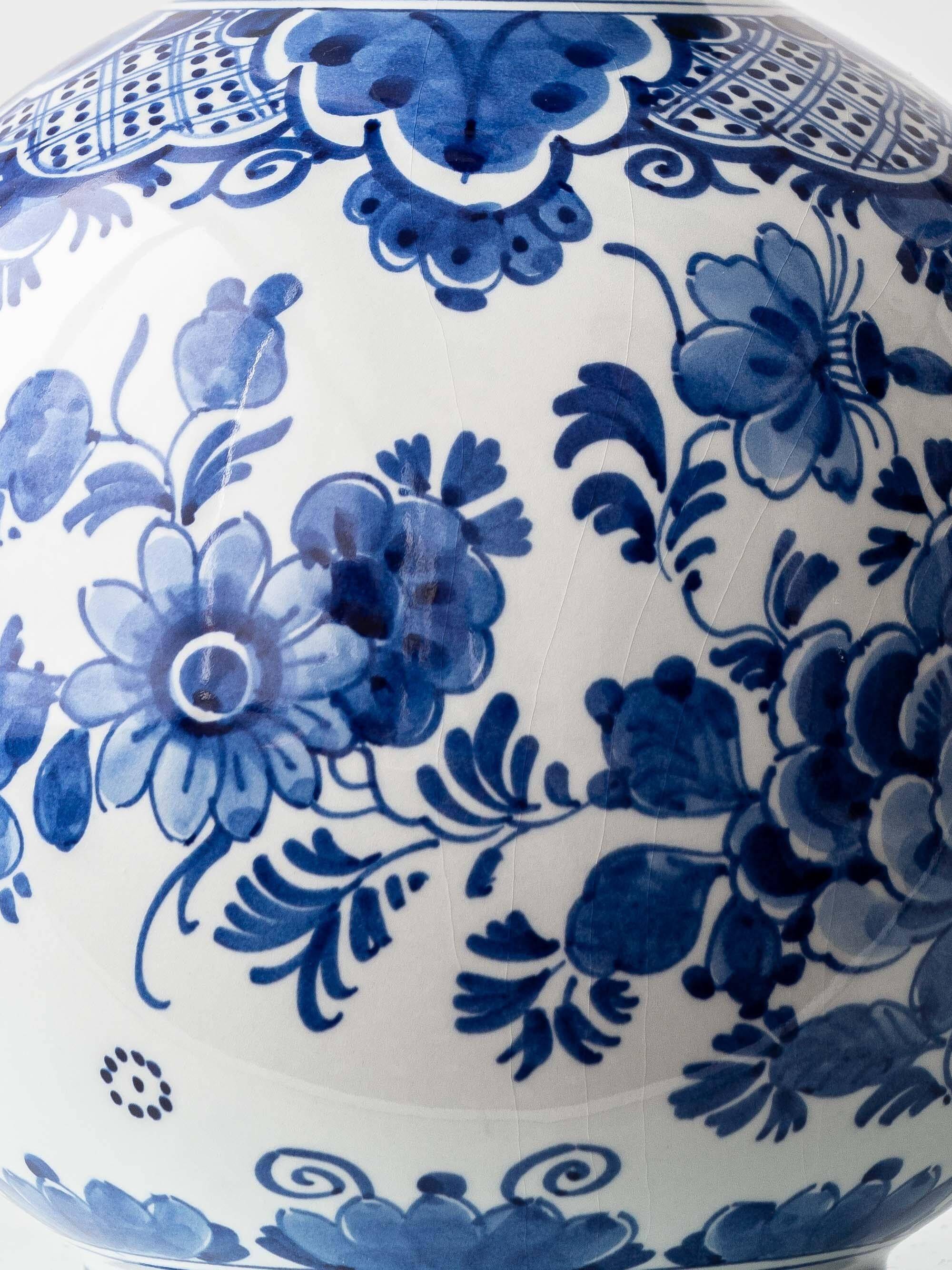 Pair of Royal Delft blue and white ceramic table lamps with new vermilion silk shades.