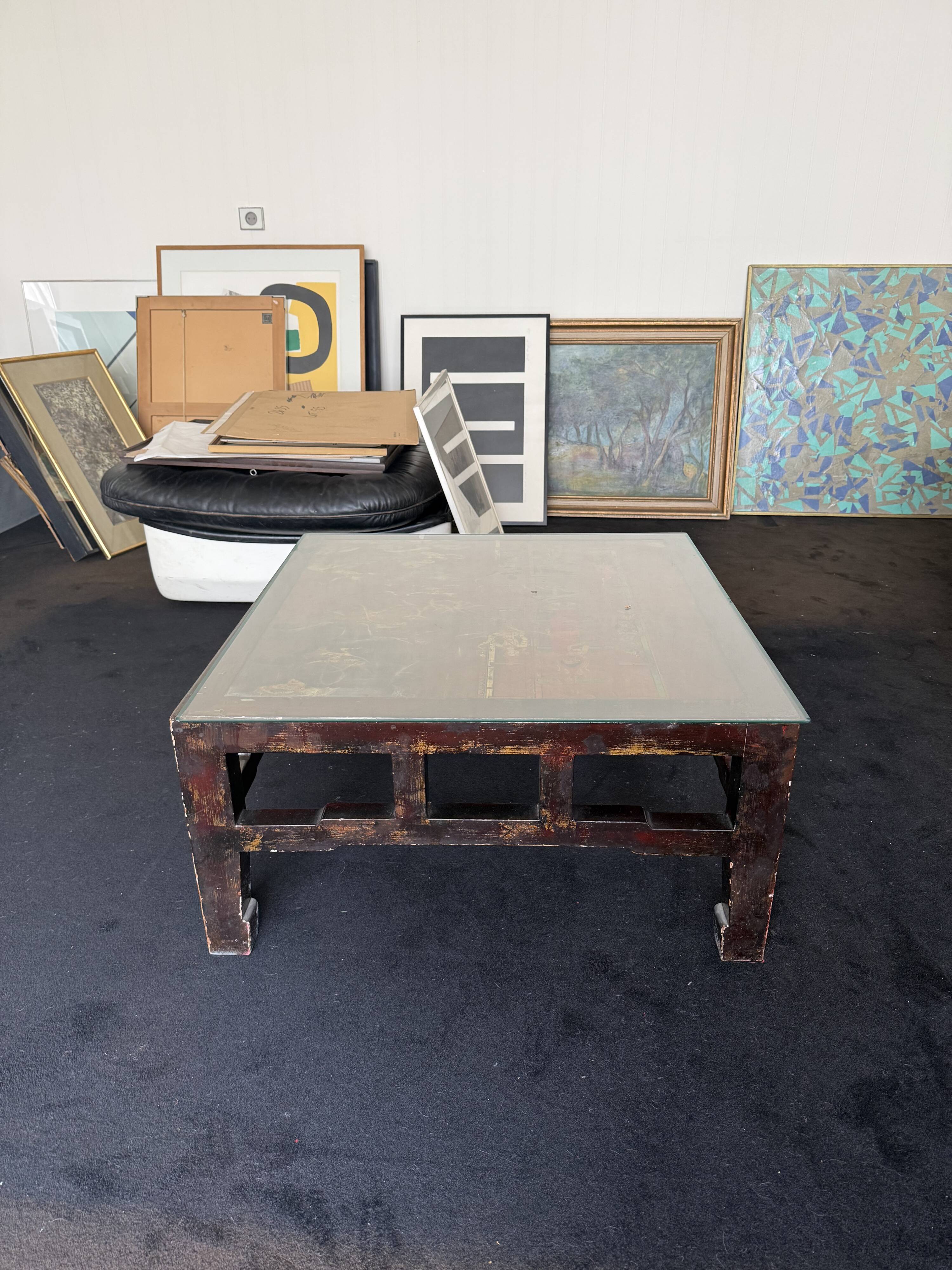 Vintage brutalist coffee table with Asian decor.