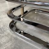 Coffee table with chrome base and mirrored glass top, vintage solar flare decor