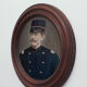 Portrait man in frame round wood