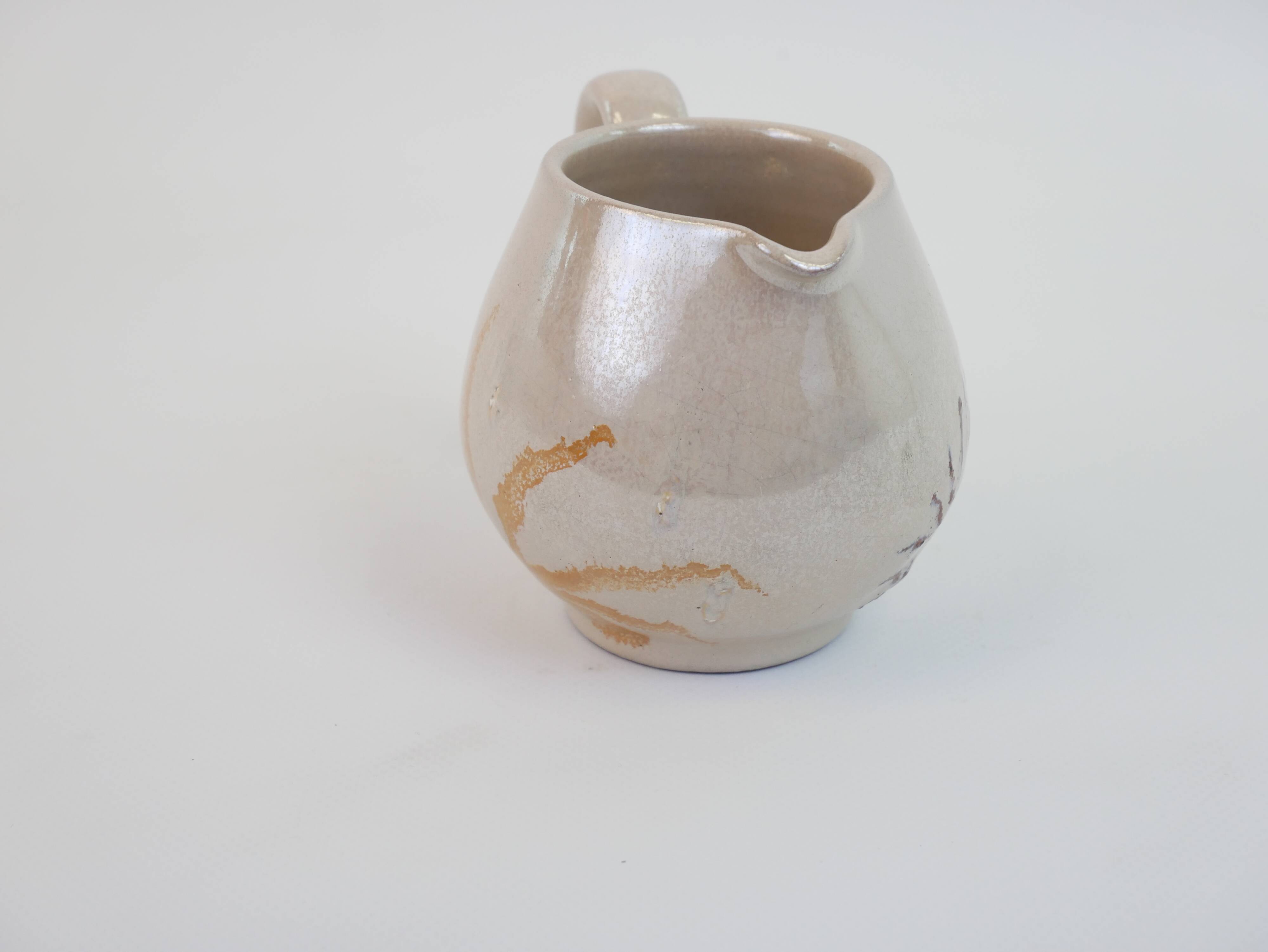 Pair of ceramic milk jugs signed La Roue Vallauris