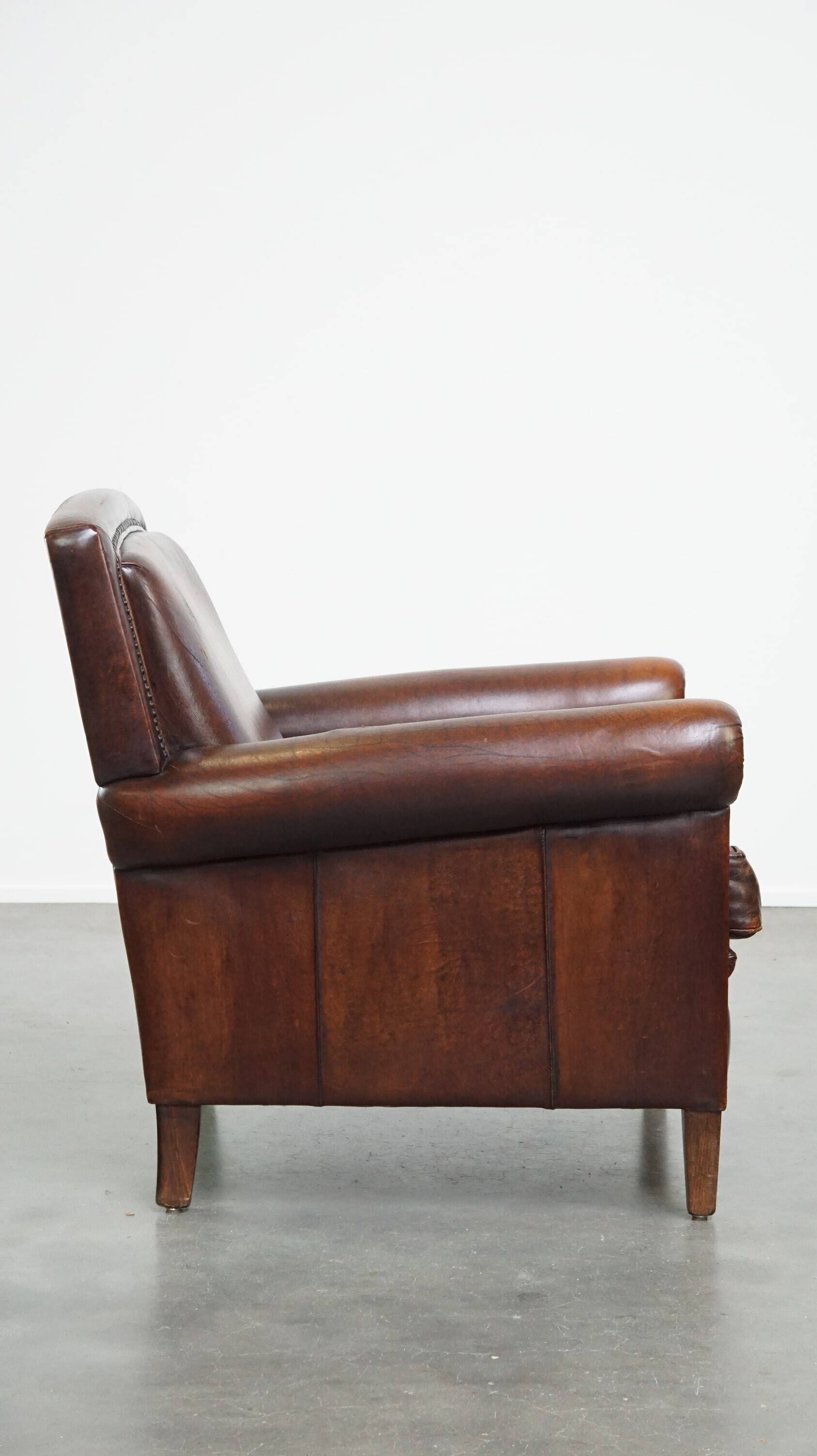 Vintage sheepskin armchair with beautiful warm colors and excellent seating comfort