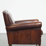 Vintage sheepskin armchair with beautiful warm colors and excellent seating comfort