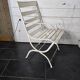 Old wrought iron and wood garden armchair