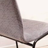 Grey fabric chair with pattern and black legs